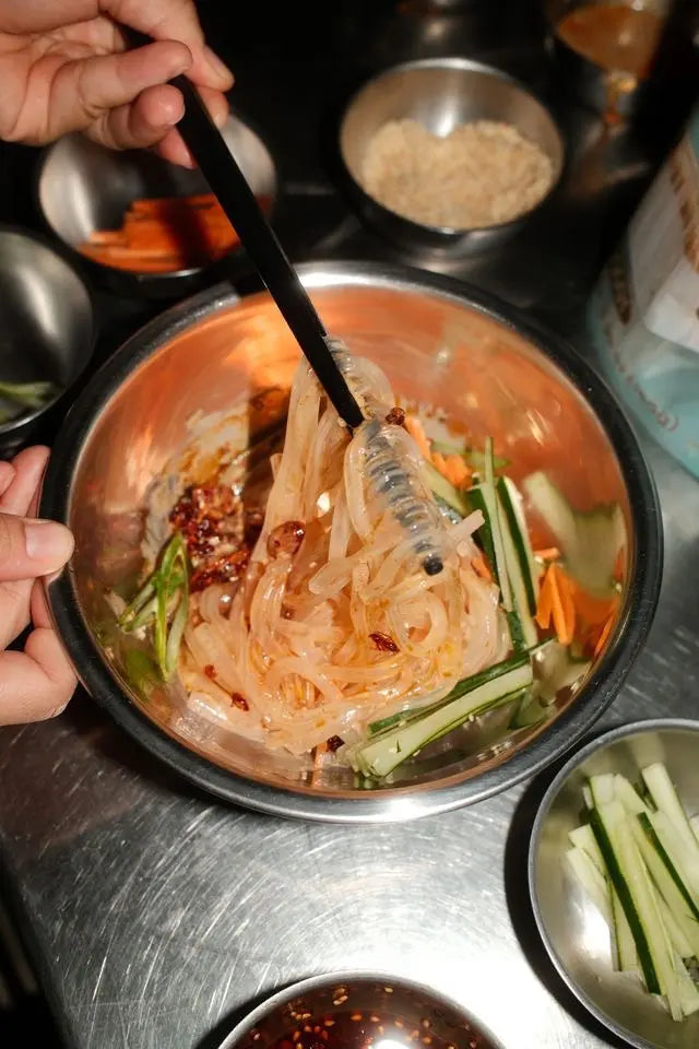 Tossing kuzukiri glass noodles at home